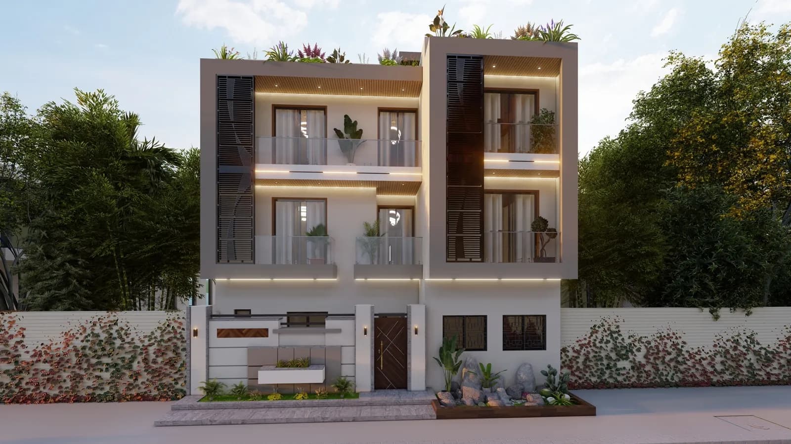 Maison Nafi Diom — façade principale au crépuscule, double volume R+2 avec toiture-terrasse végétalisée